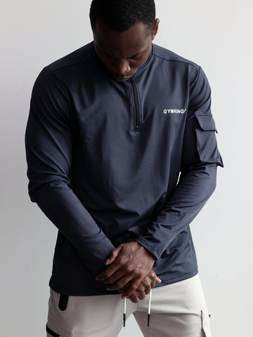 Camisa de manga larga con cremallera 1/4 y bolsillo cargo